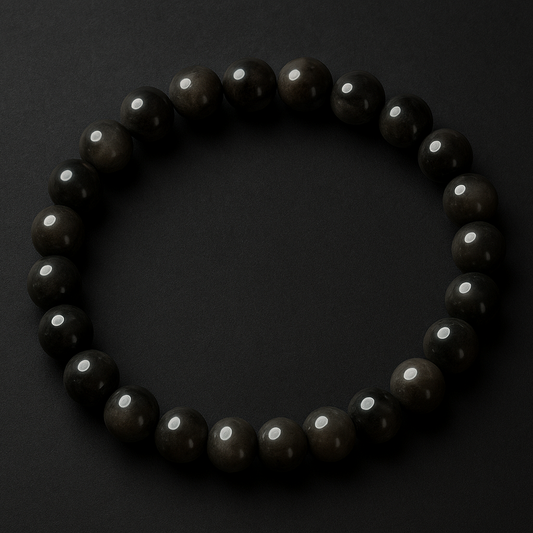 Black beaded bracelet on a dark background